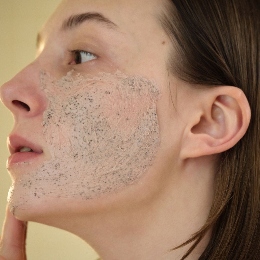 Applying red bean mask to cheek