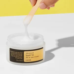 Close-up of snail mucin cream texture for acne-prone skin