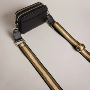 Ted Baker camera bag worn as clutch