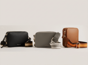 Ted Baker camera bag worn as clutch